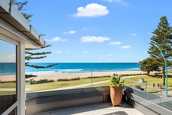Balcony view of the beach and ocean from Pavilion Beachfront Apartments, Mount Maunganui.
